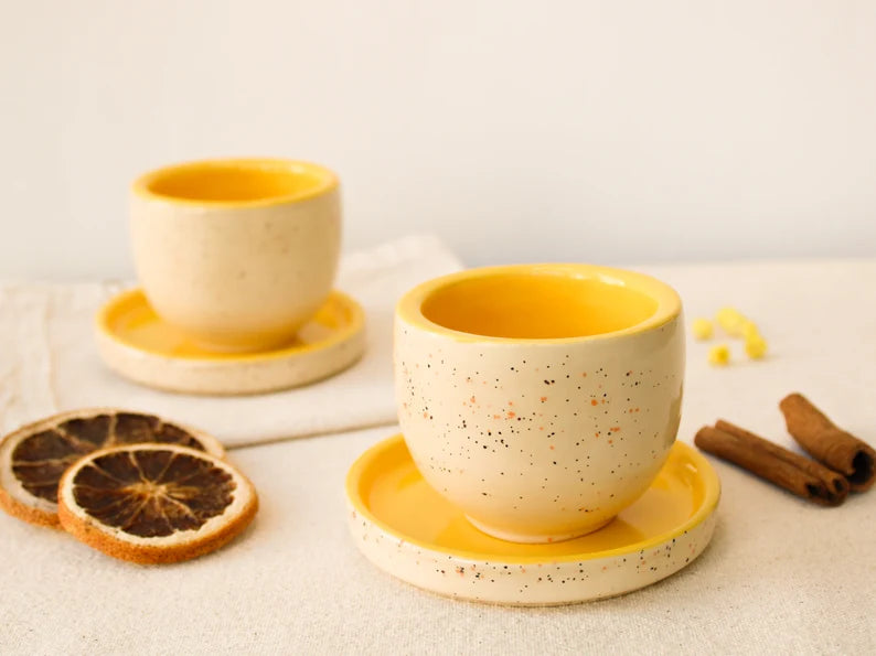 Yellow Speckled Handleless Coffee Mug and Saucer